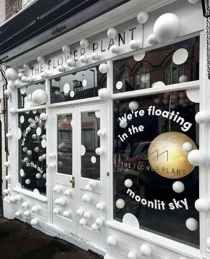 Moonlight florist window display white floating balls shopfront 2023 the flower plant