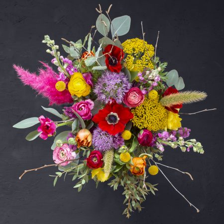 Multicoloured bouquet with allium anemone ranunculus achillea craspedia stocks tulips statice pennisetum pink pampas mixed eucalyptus
