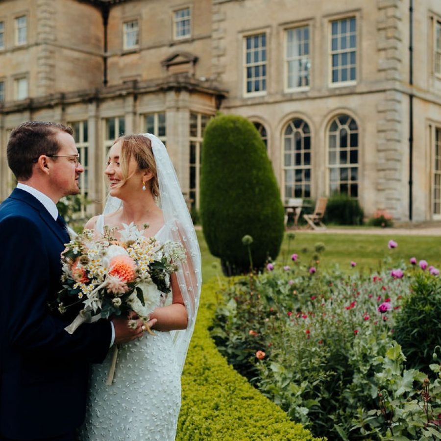 Bride and groom peach wild flowers