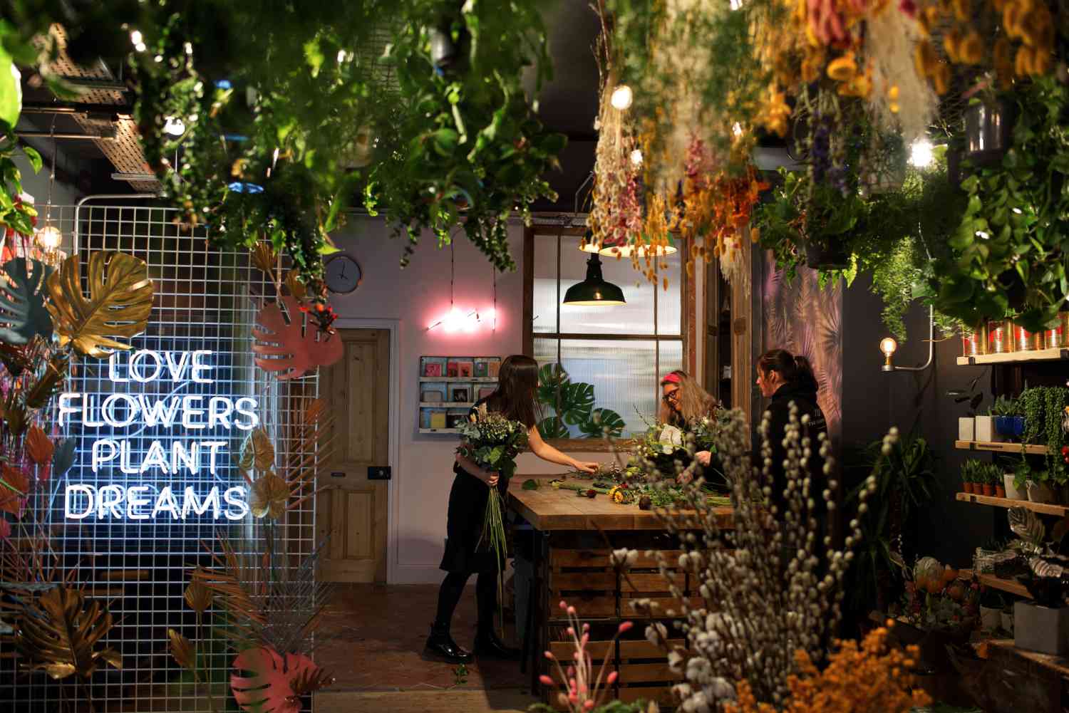 The Flower Plant team at work neon sign floral bouquet