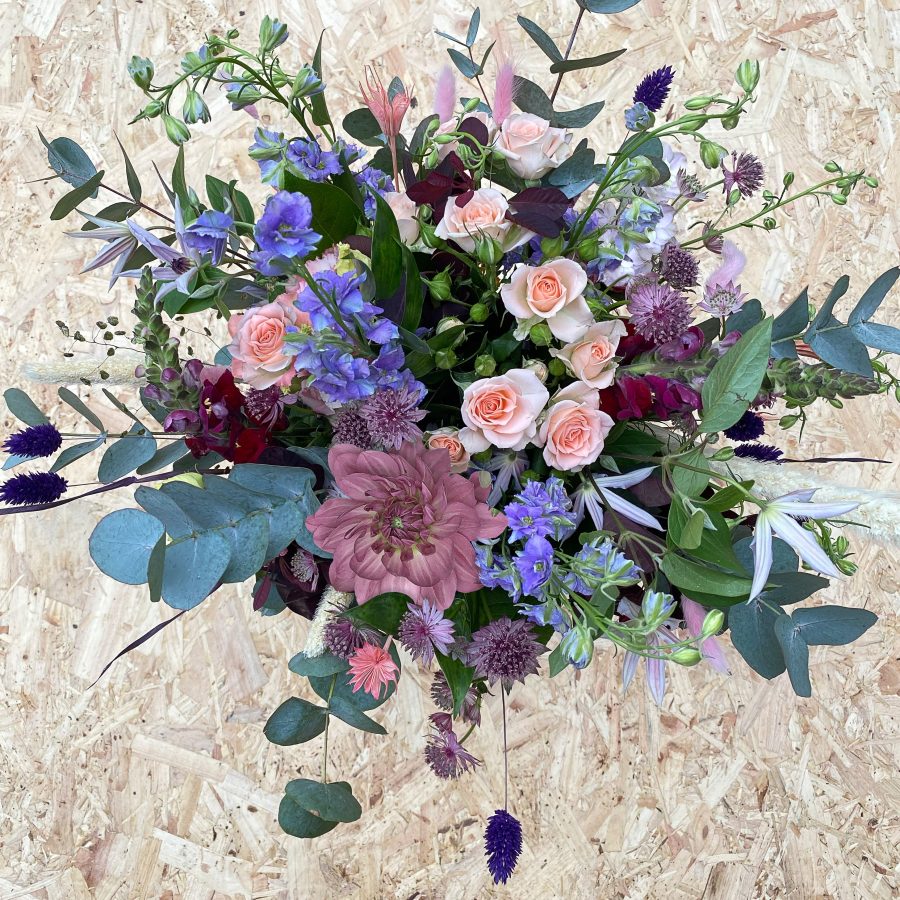 Pastel coloured hand-tied flower bouquet