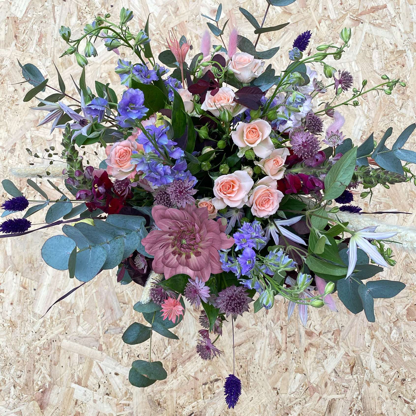 Pastel coloured hand-tied flower bouquet