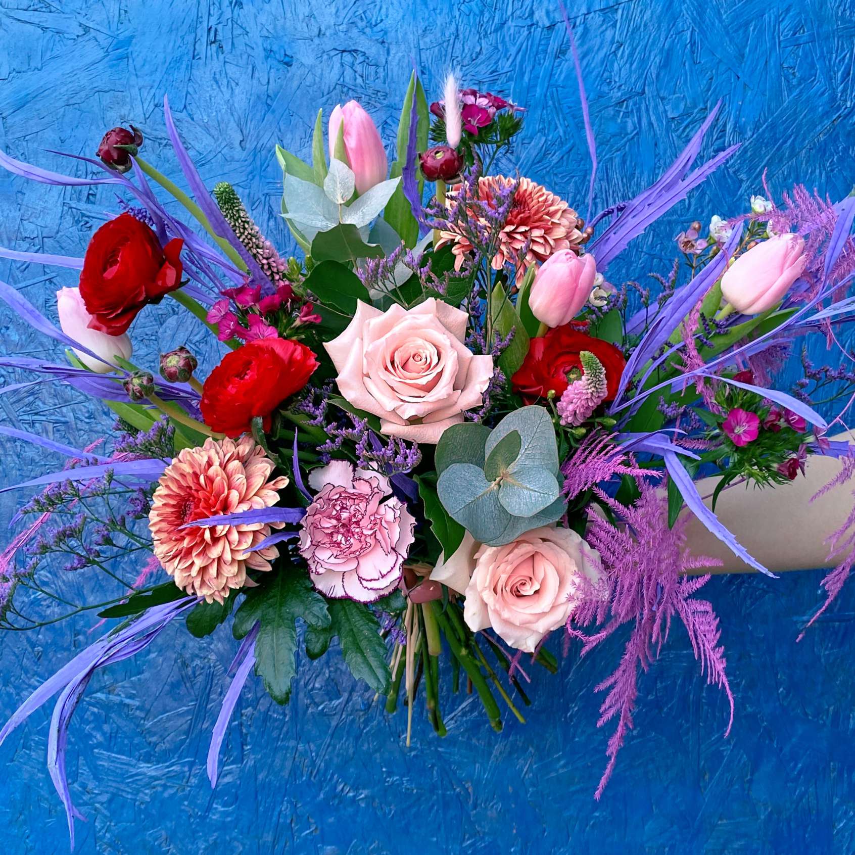 Pink, reds ranunculus, roses, tulips and eucalyptus - Valentine's flowers