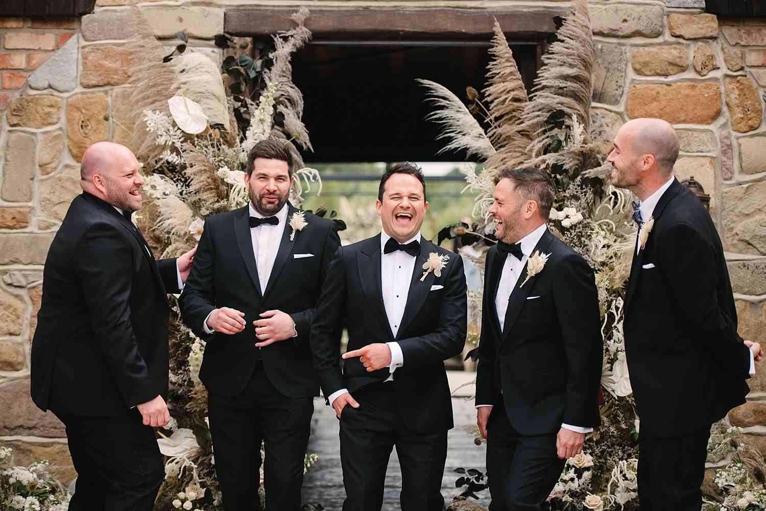 Groomsmen Under Dried Arch