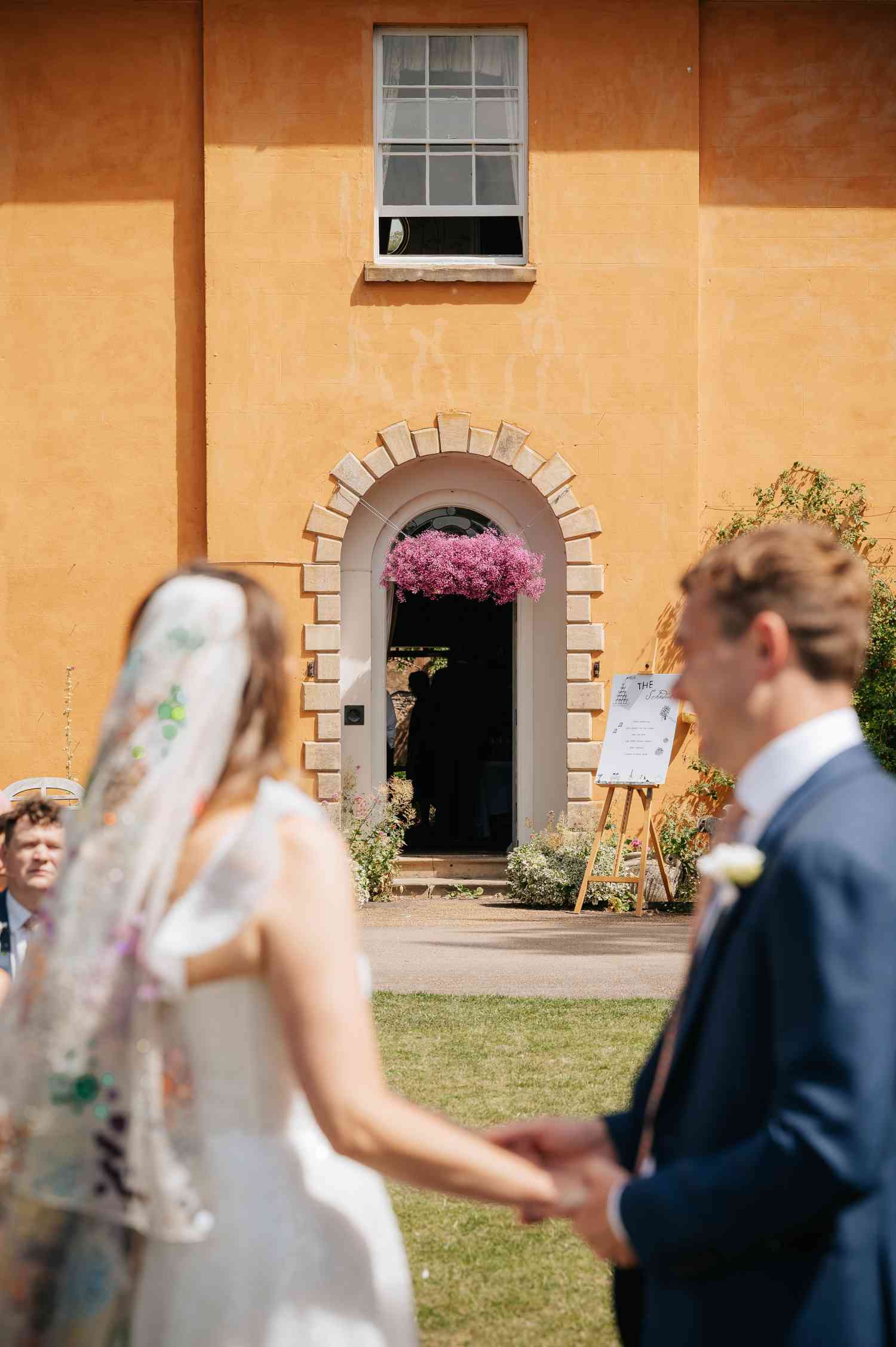 Rosie James Langar Hall Floral Cloud Ceremony Entrance