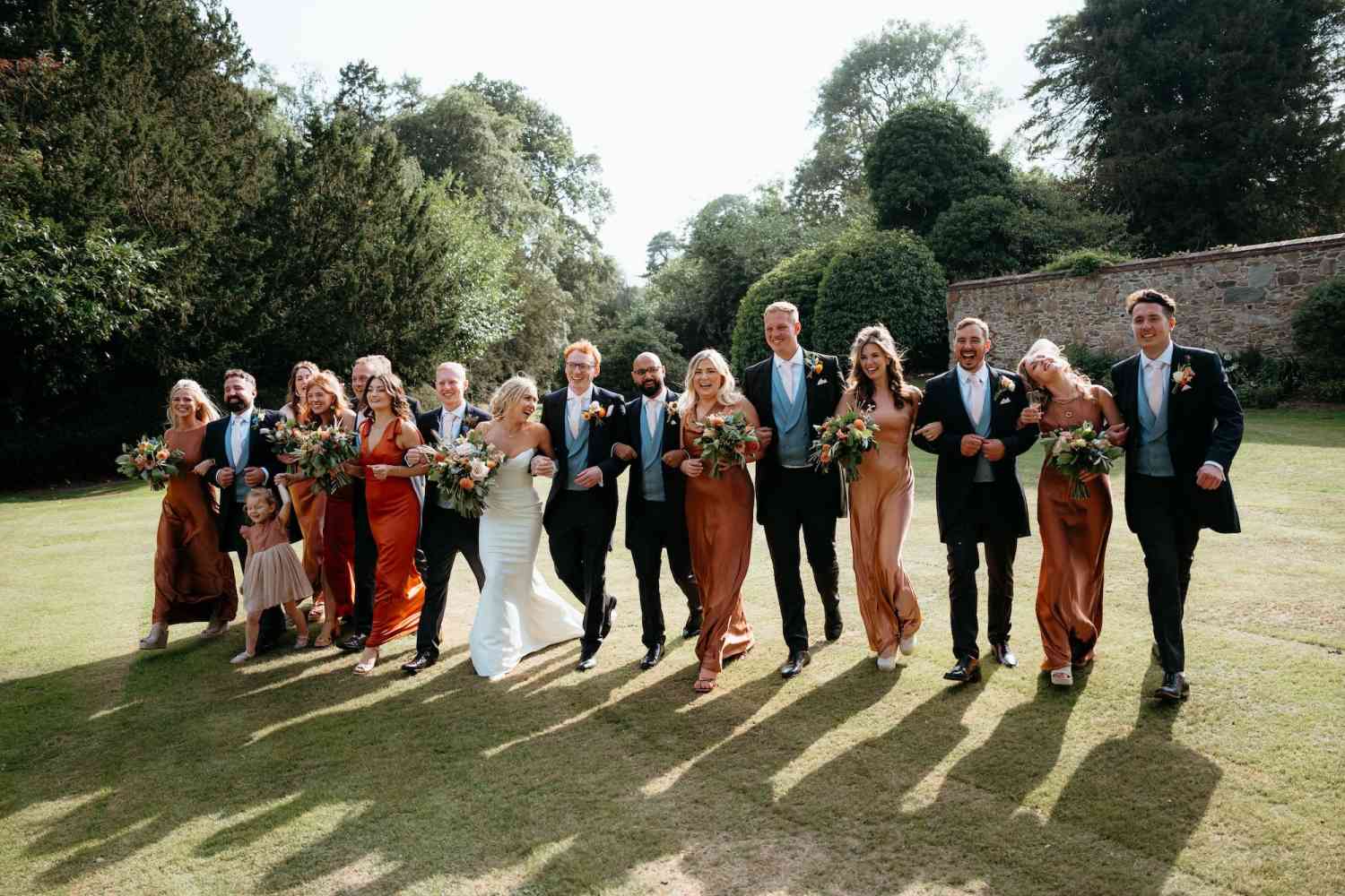 Wedding party bouquets peach rust orange flowers natural garden style copy