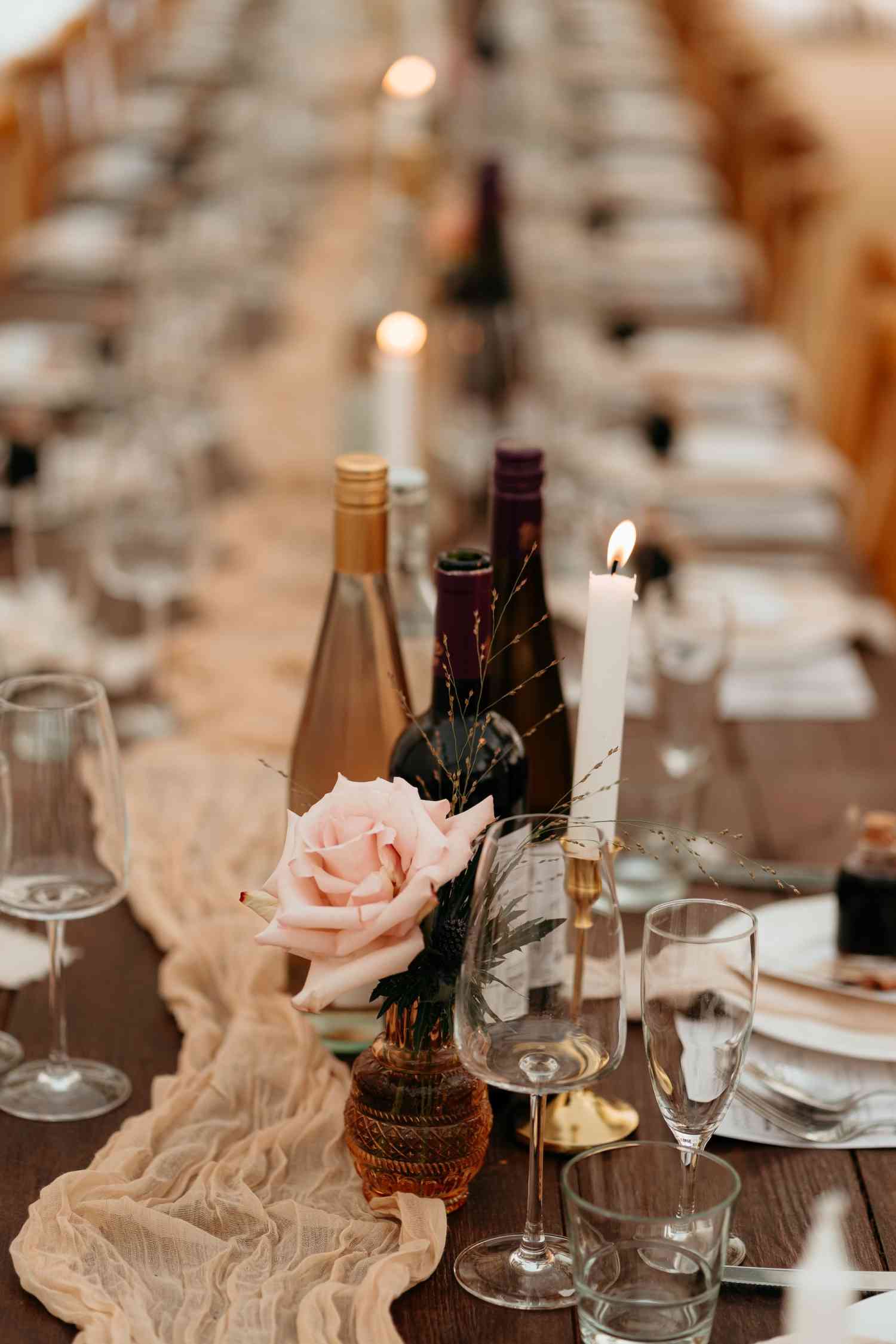 Wedding table centrepiece single rose bud vase candlelight styling copy
