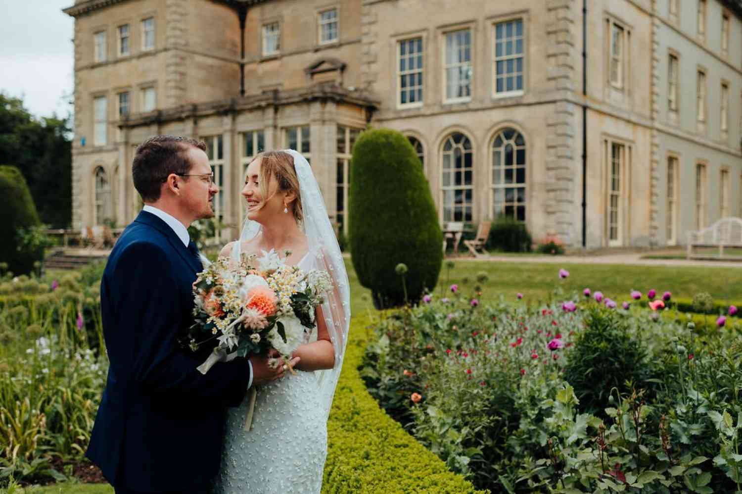 Bride and groom peach wild flowers