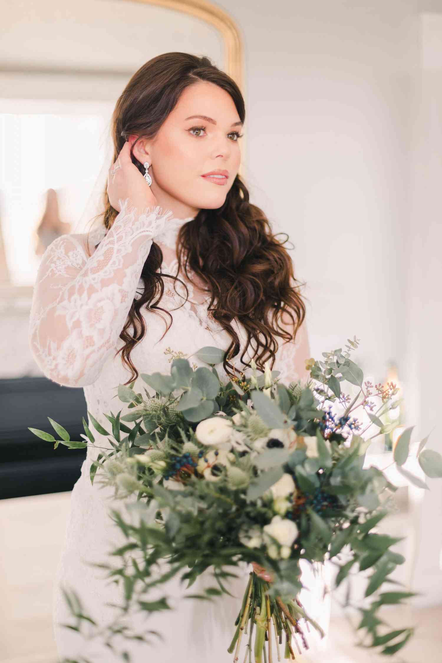 Bride holding wild whimsical bouquet